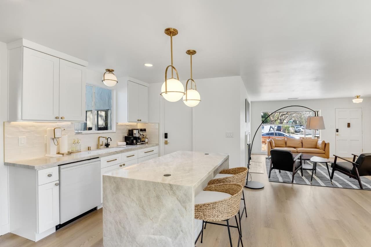 House Renovation in Davis — shaker cabinets, kitchen island, marble countertop, pendant lighting, open-concept layout