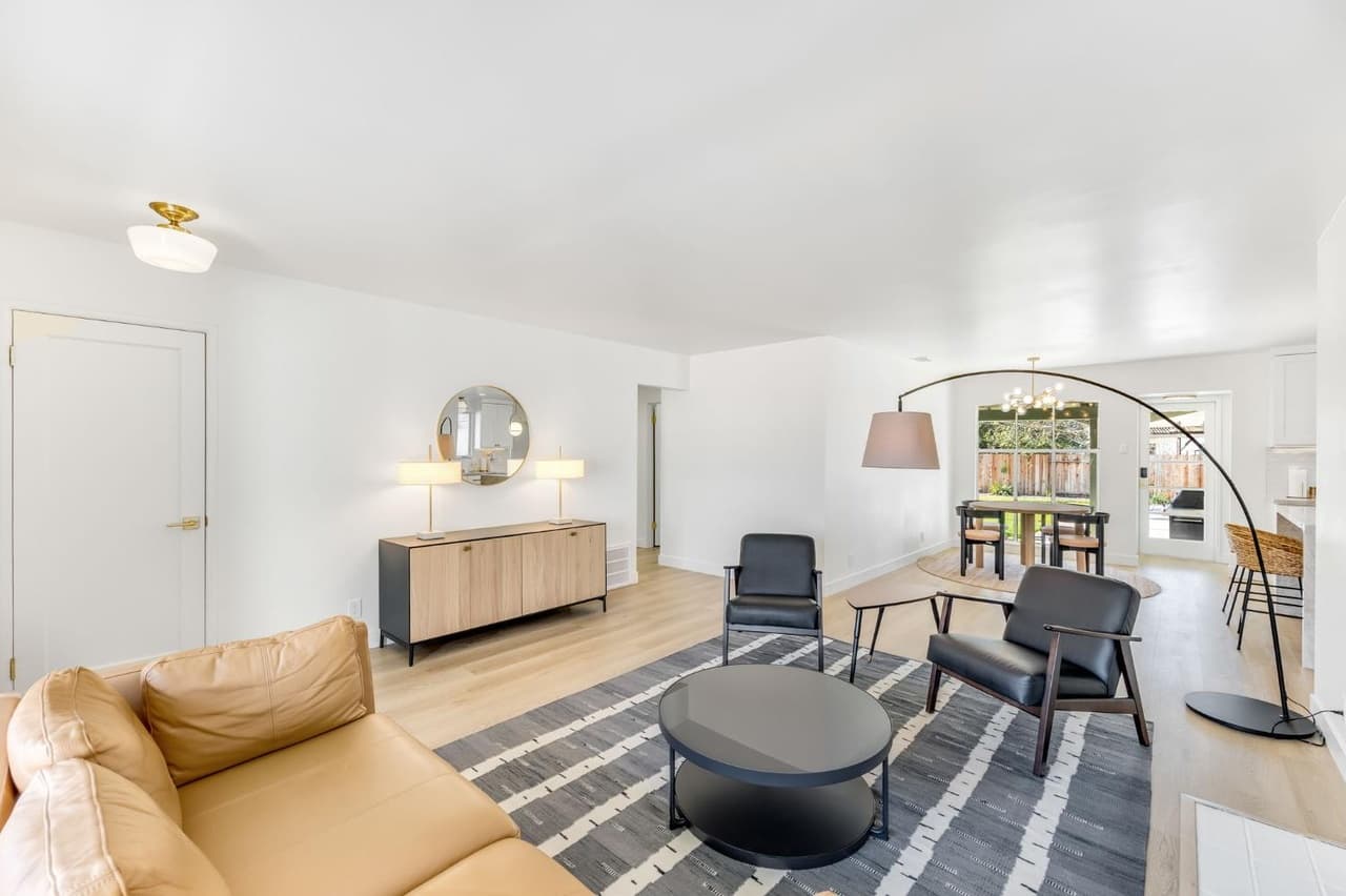 House Renovation in Davis — open-concept layout, hardwood flooring, luxury vinyl plank, framed mirror, pendant lighting