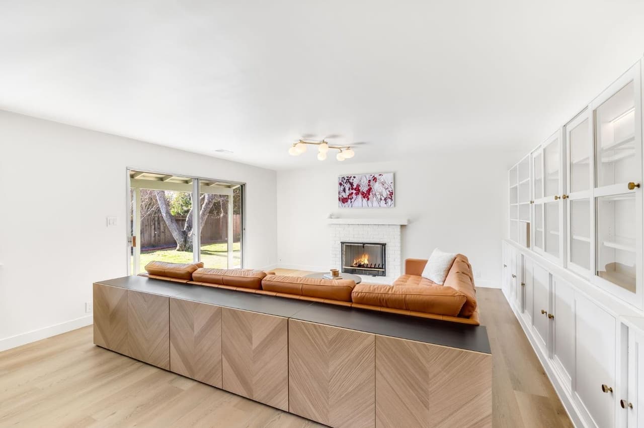 House Renovation in Davis — fireplace, built-in shelving, hardwood flooring, custom cabinetry, open-concept layout