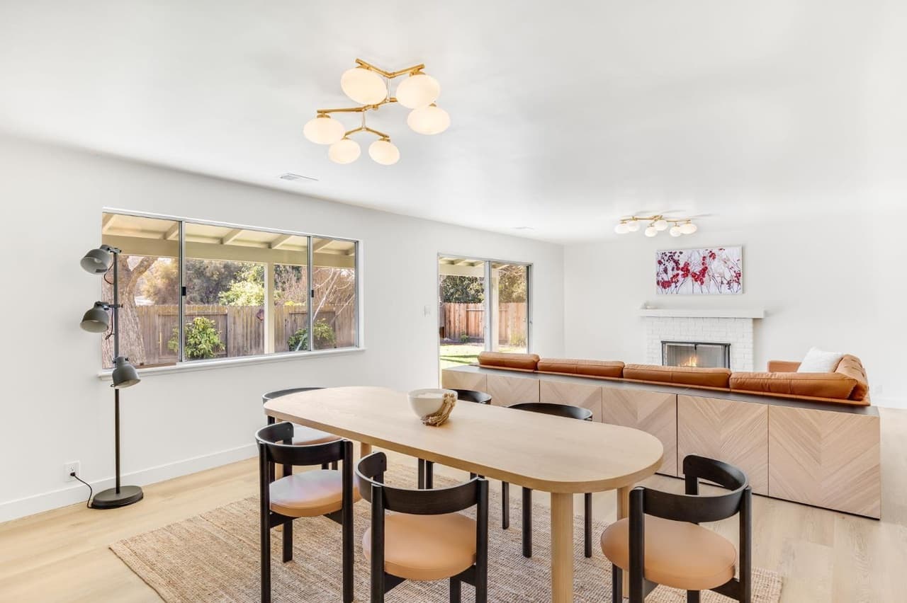 House Renovation in Davis — open-concept layout, fireplace, hardwood flooring, pendant lighting, custom cabinetry