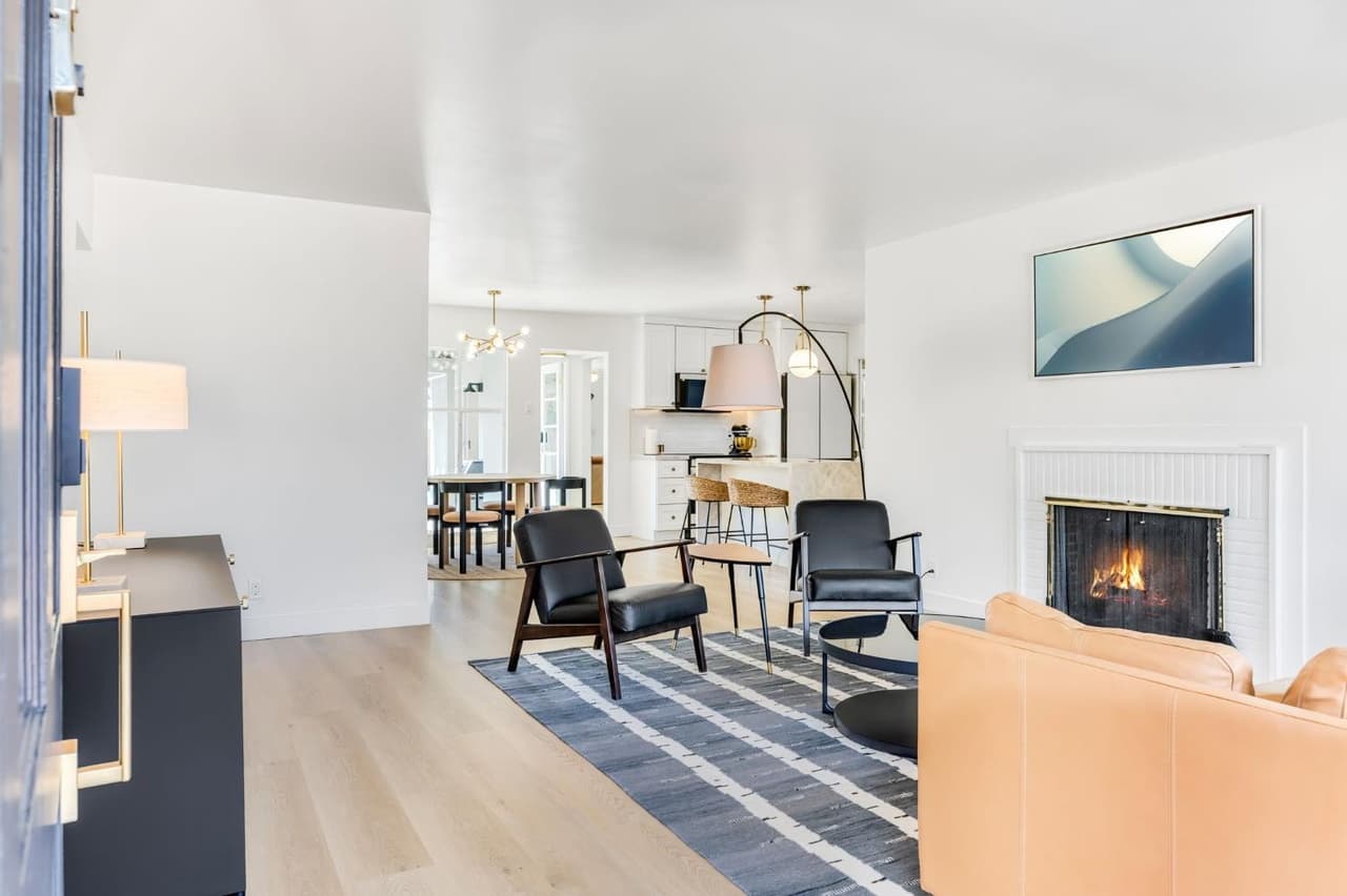 House Renovation in Davis — open-concept layout, fireplace, hardwood flooring, pendant lighting, kitchen island