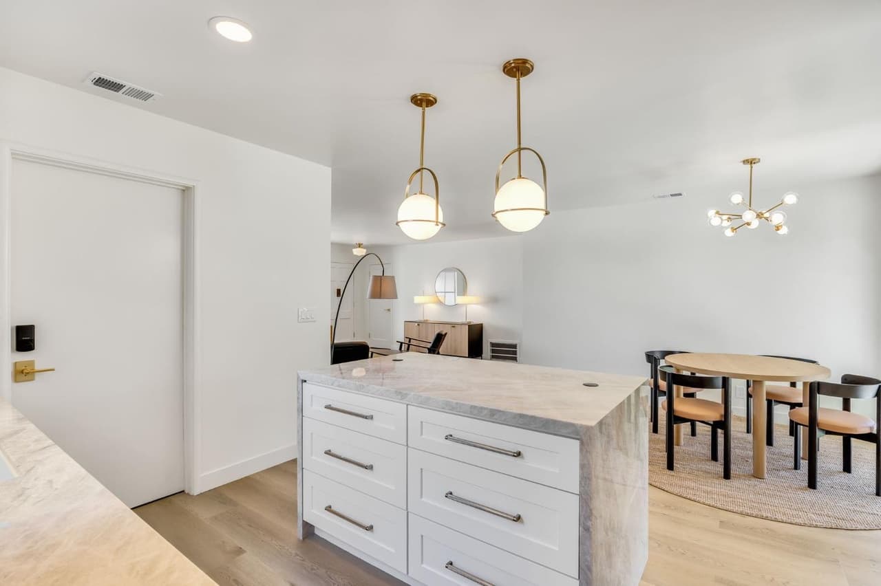 House Renovation in Davis — kitchen island, pendant lighting, recessed lighting, shaker cabinets, hardwood flooring