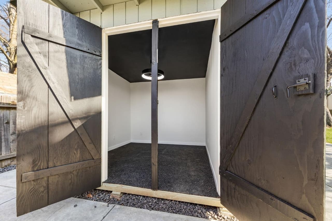 House Renovation in Davis — barn-door entry, recessed lighting, exterior paint, fiber-cement siding, covered patio