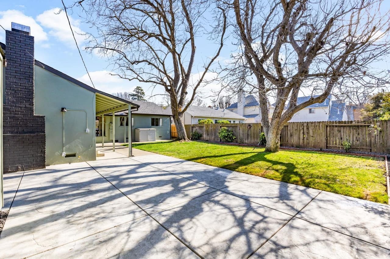 House Renovation in Davis — covered patio, stucco facade, fireplace, exterior paint, stone veneer