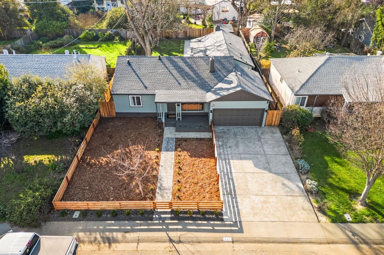 House Renovation in Davis — exterior paint, garage door, front porch, fiber-cement siding, landscape lighting