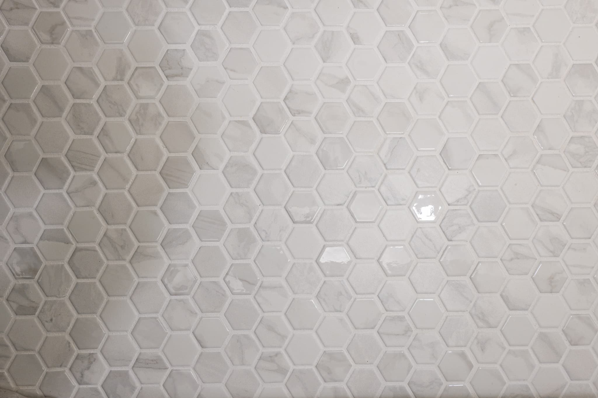 House Renovation in Sacramento — mosaic backsplash, marble tile flooring, tiled shower surround, natural-stone backsplash