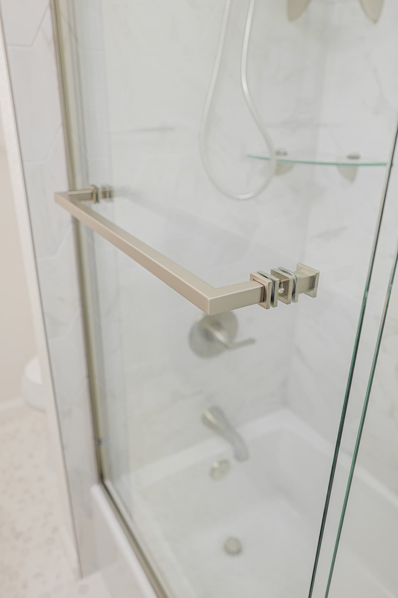 House Renovation in Sacramento — frameless glass shower, walk-in shower, tiled shower surround, handheld shower, shower bench