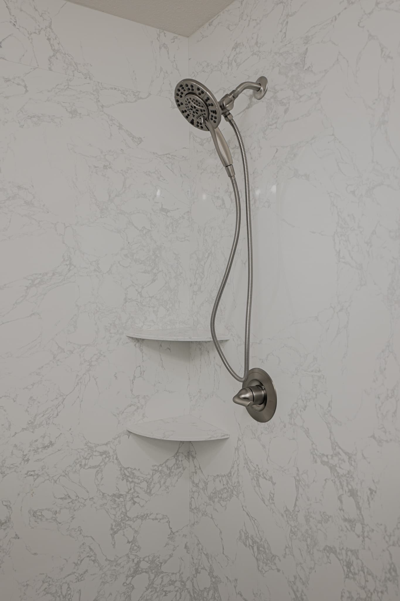 House Renovation in Sacramento — walk-in shower, tiled shower surround, handheld shower, rain shower head, built-in shelving