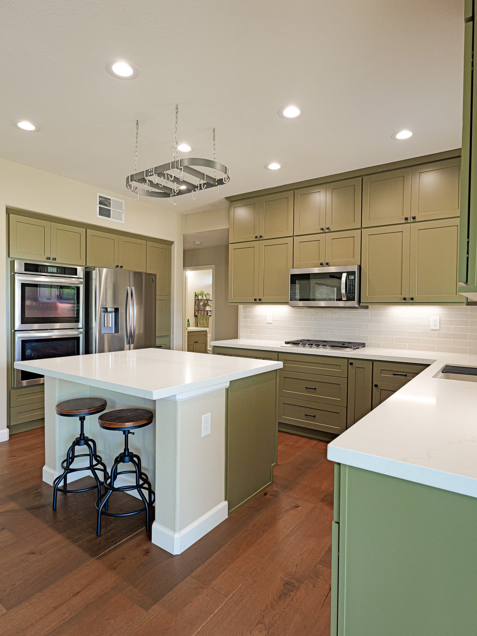 Bathroom Remodel in Sacramento — shaker cabinets, kitchen island, quartz countertop, subway tile backsplash, recessed lighting, stainless appliances, hardwood flooring