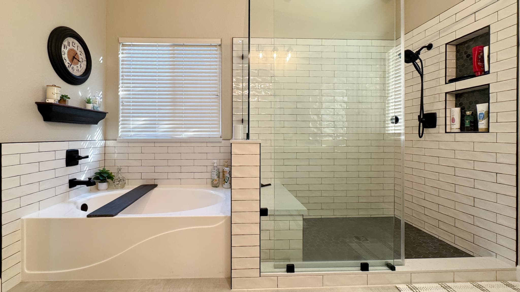 Bathroom Remodel in Sacramento — frameless glass shower, tiled shower surround, subway tile backsplash, soaking tub, shower bench