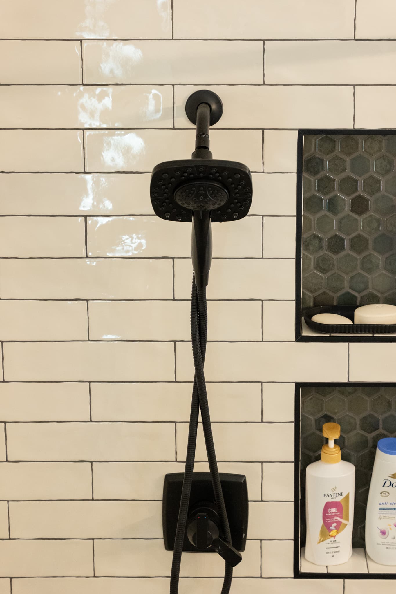 Bathroom Remodel in Sacramento — tiled shower surround, handheld shower, subway tile backsplash, mosaic backsplash, built-in shelving