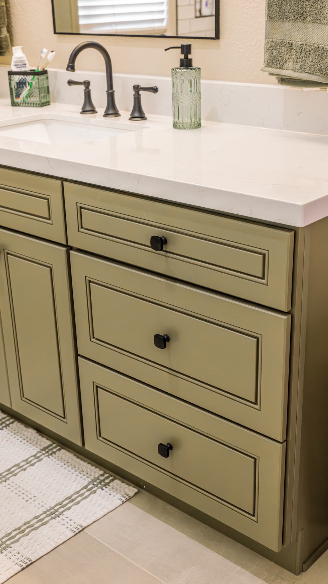 Bathroom Remodel in Sacramento — raised-panel cabinets, single vanity, undermount sink, quartz countertop, framed mirror