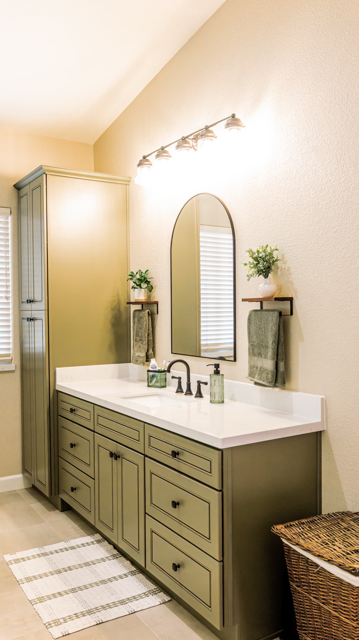 Bathroom Remodel in Sacramento — raised-panel cabinets, single vanity, quartz countertop, linen tower, undermount sink