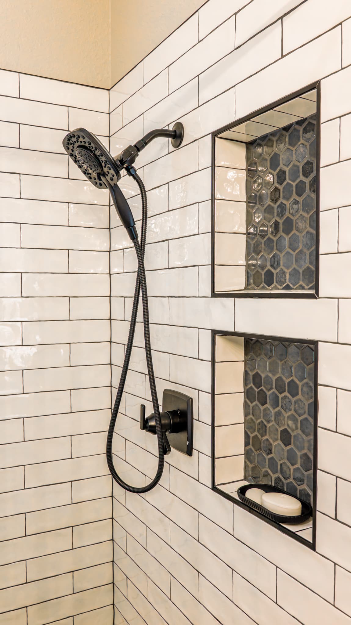 Bathroom Remodel in Sacramento — tiled shower surround, subway tile backsplash, handheld shower, mosaic backsplash, walk-in shower