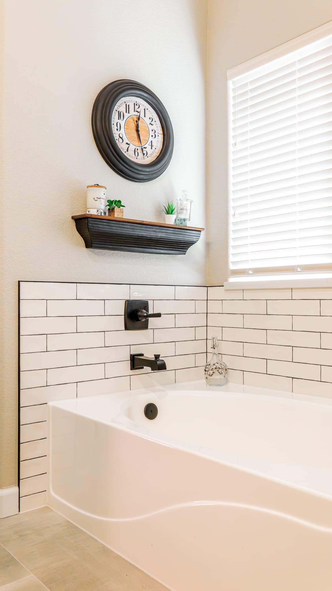 Bathroom Remodel in Sacramento — soaking tub, subway tile backsplash, porcelain tile flooring, built-in shelving, ceramic tile flooring