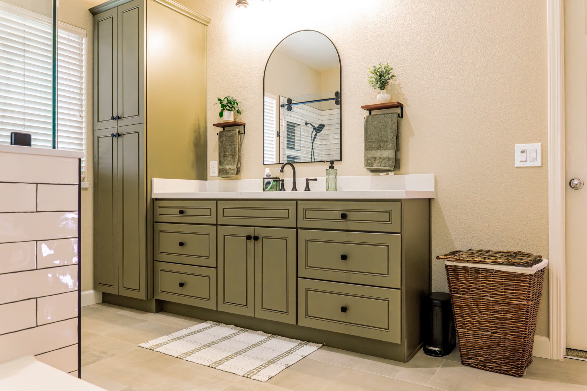 Bathroom Remodel in Sacramento — raised-panel cabinets, linen tower, single vanity, quartz countertop, porcelain tile flooring