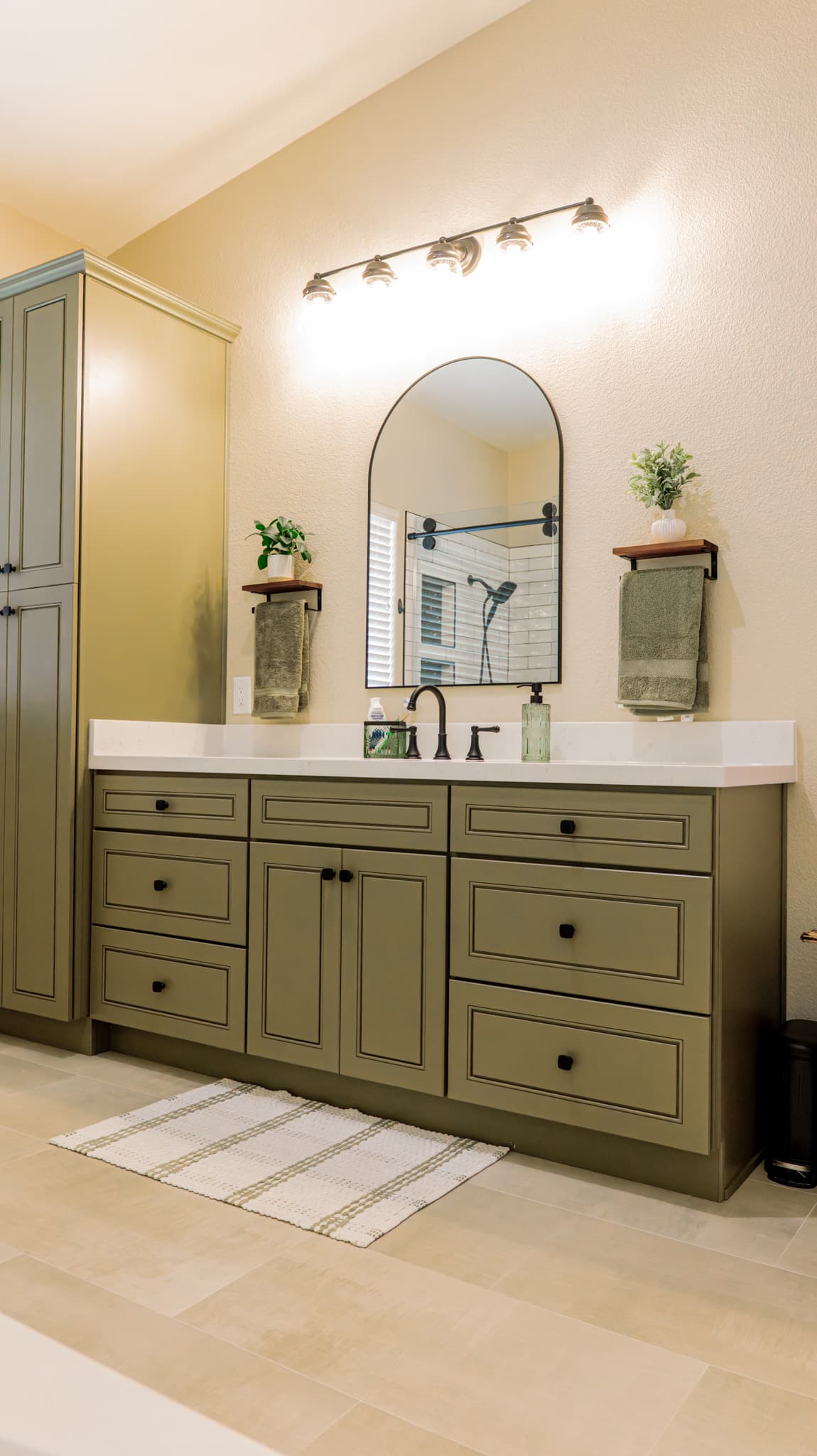 Bathroom Remodel in Sacramento — raised-panel cabinets, single vanity, linen tower, quartz countertop, framed mirror