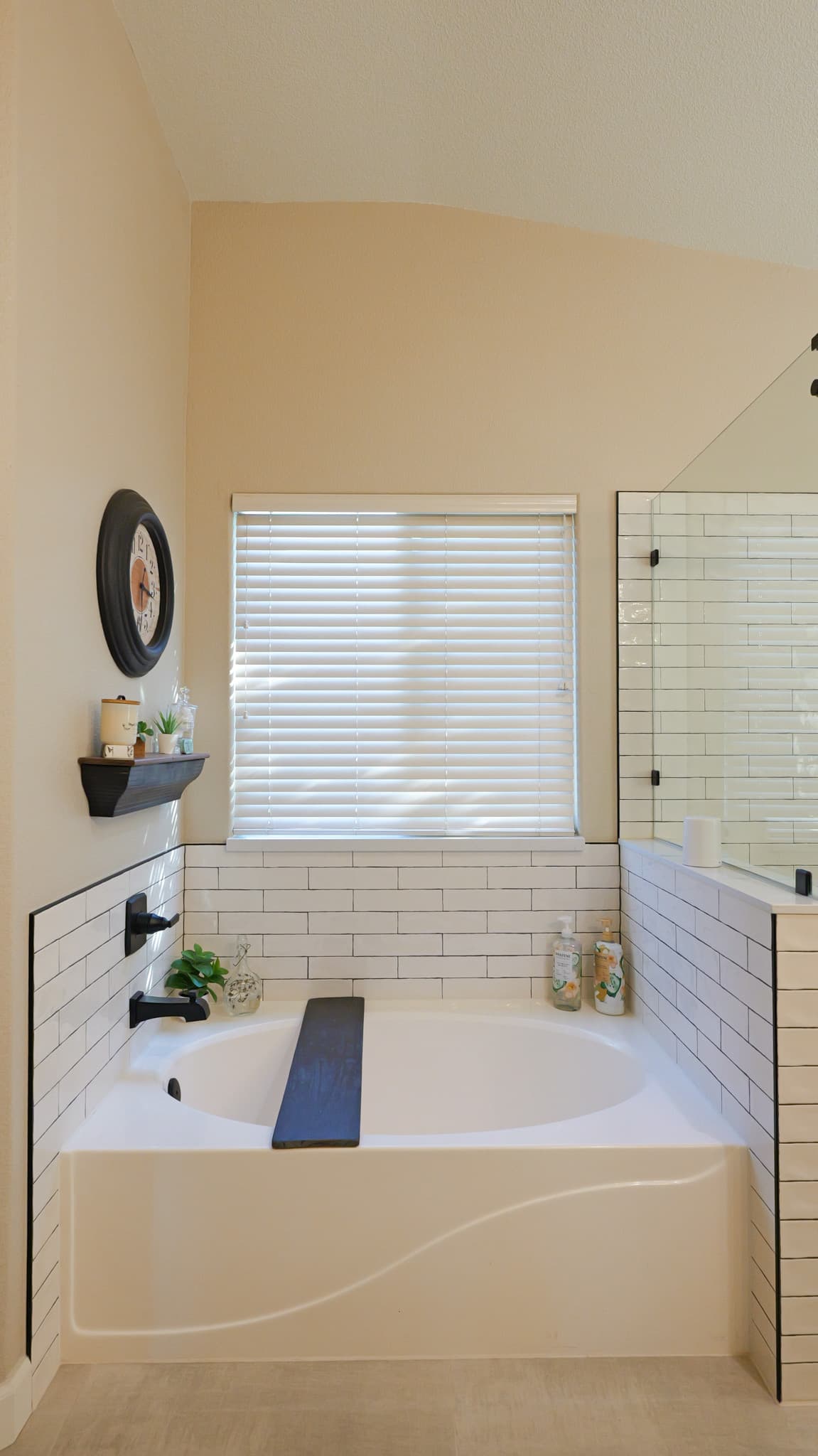Bathroom Remodel in Sacramento — soaking tub, subway tile backsplash, frameless glass shower, vaulted ceiling, built-in shelving
