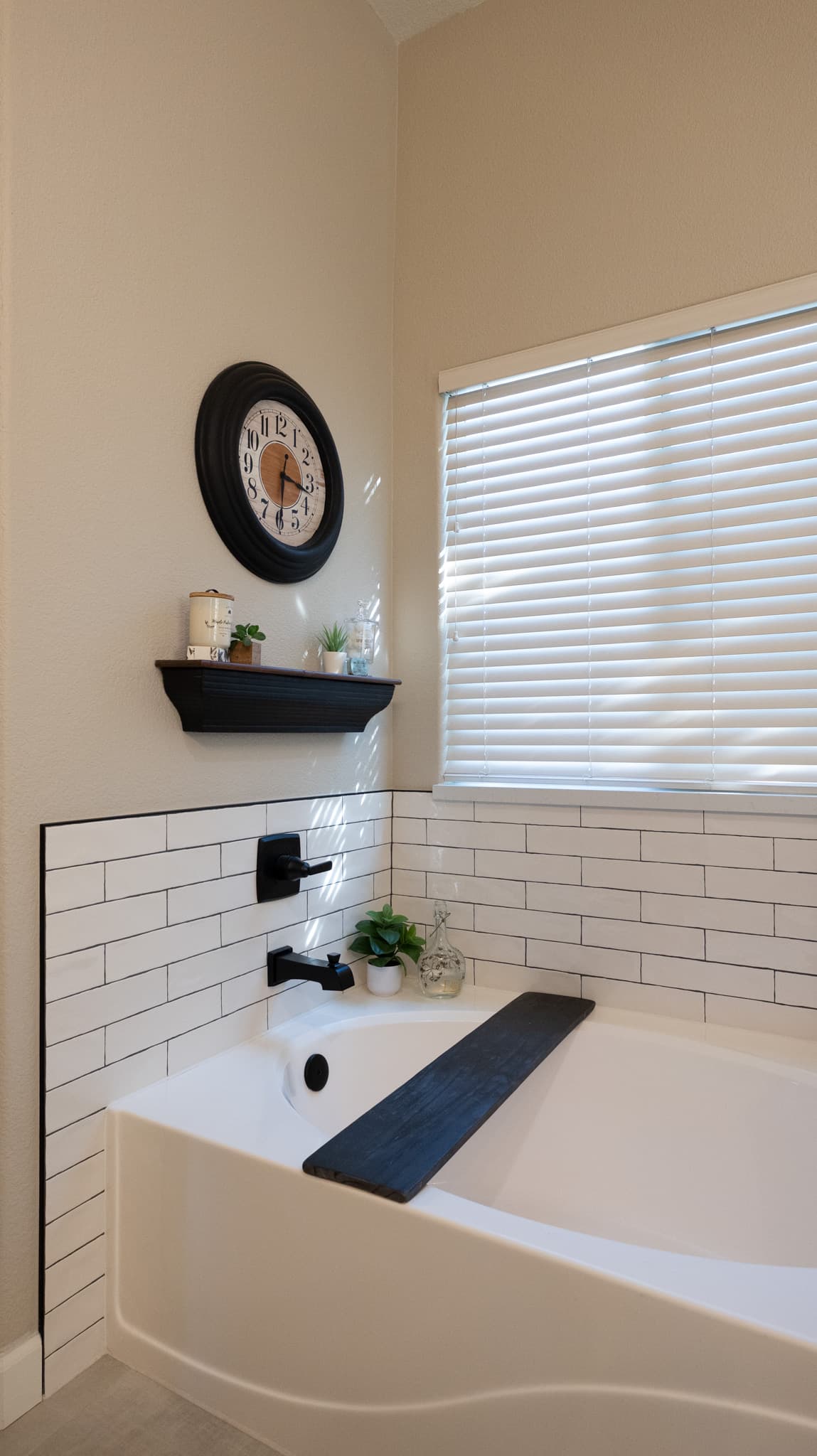 Bathroom Remodel in Sacramento — soaking tub, subway tile backsplash, built-in shelving, tiled shower surround, luxury vinyl plank