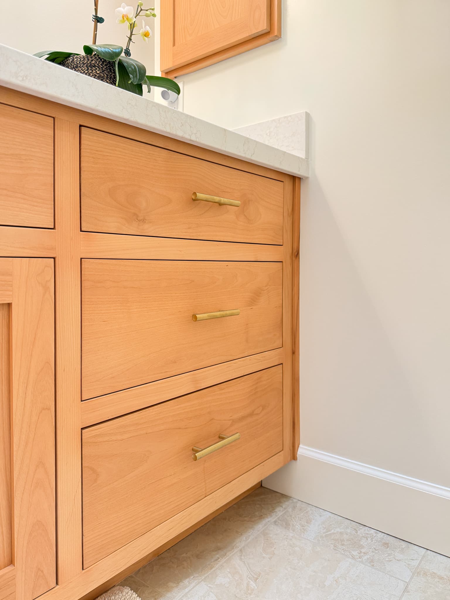 Bathroom Remodel in Carmichael — custom cabinetry, quartz countertop, single vanity, porcelain tile flooring