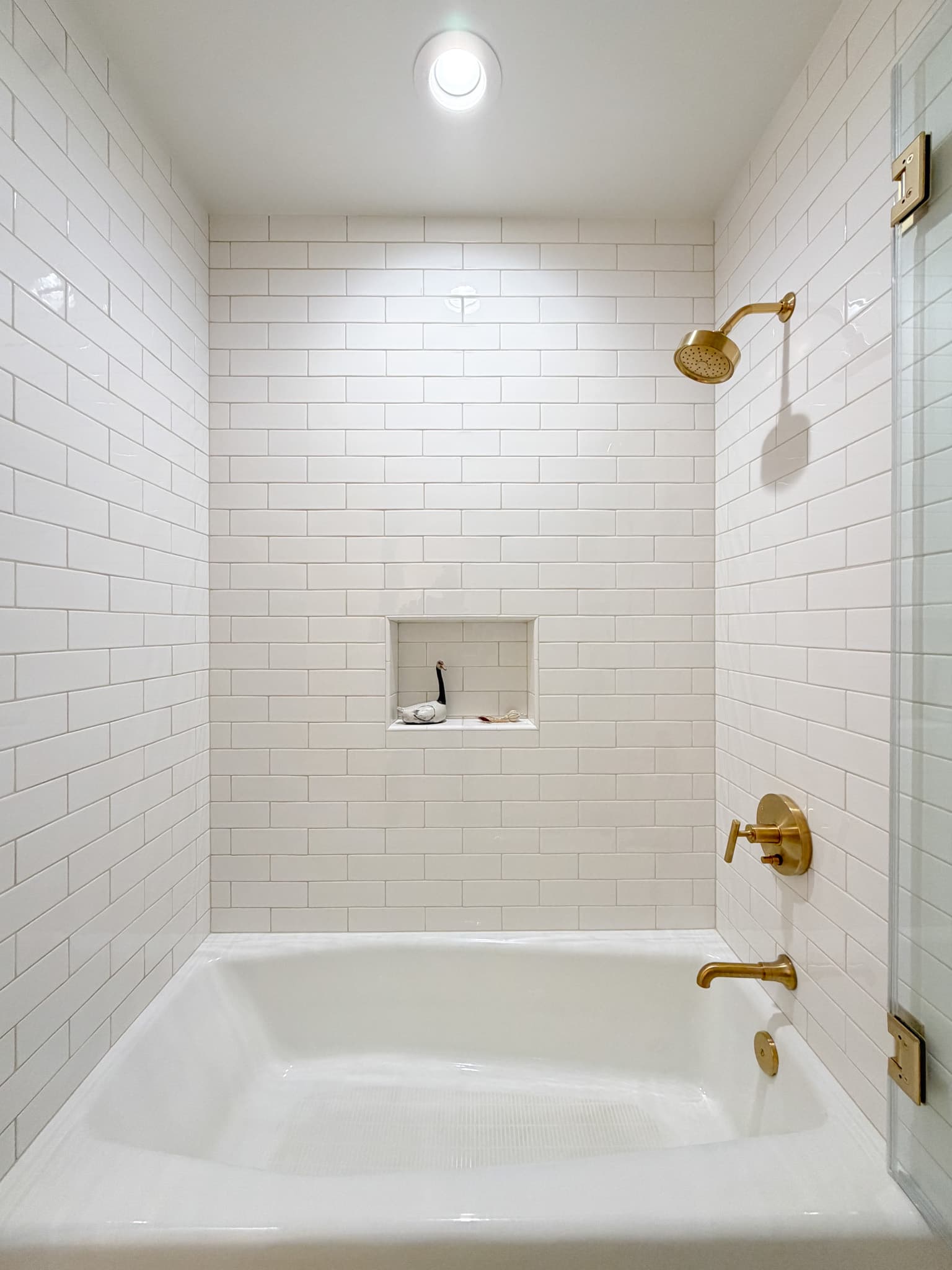 Bathroom Remodel in Carmichael — tiled shower surround, subway tile backsplash, soaking tub, frameless glass shower, recessed lighting