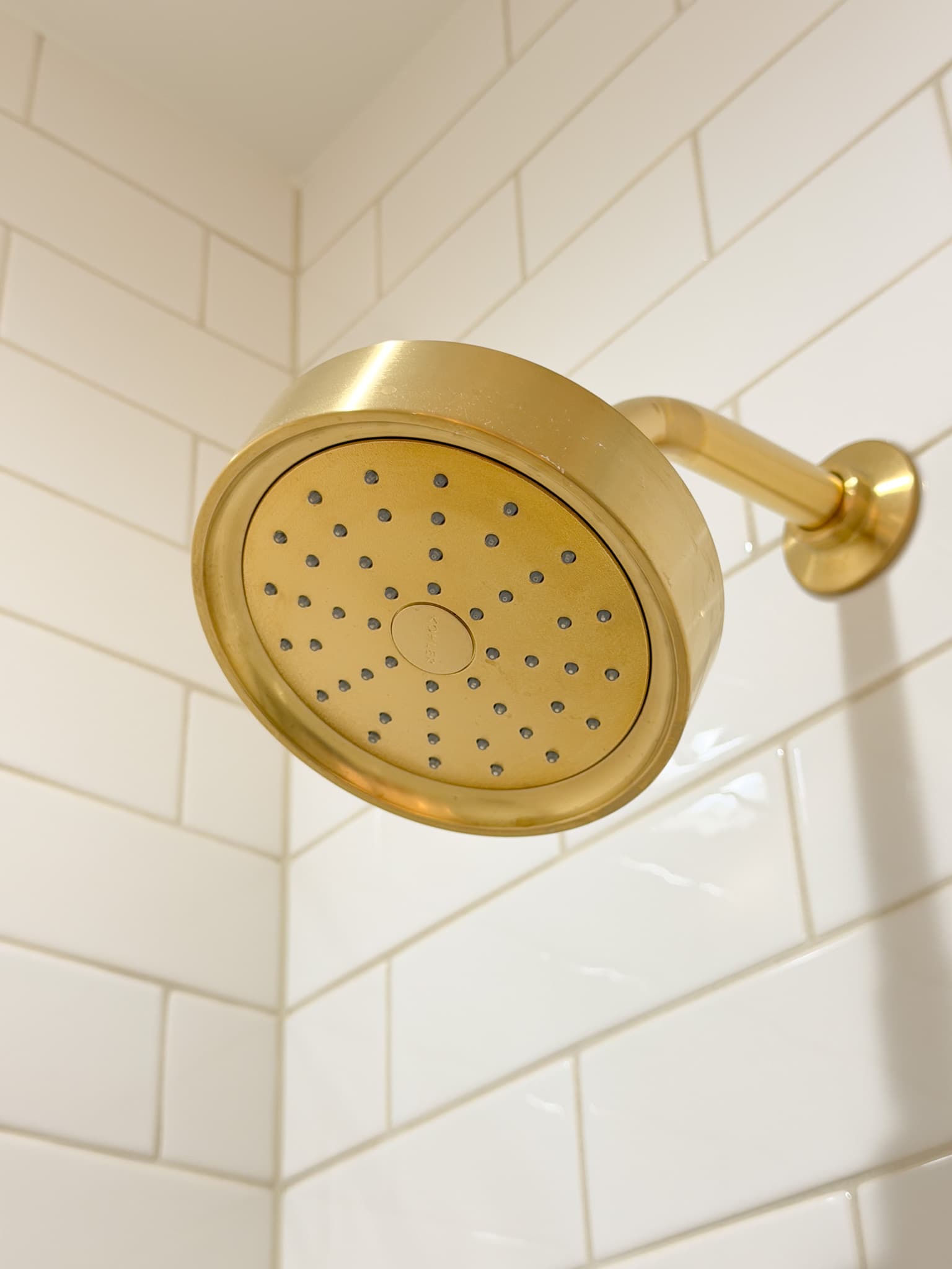 Bathroom Remodel in Carmichael — tiled shower surround, walk-in shower, rain shower head, subway tile backsplash
