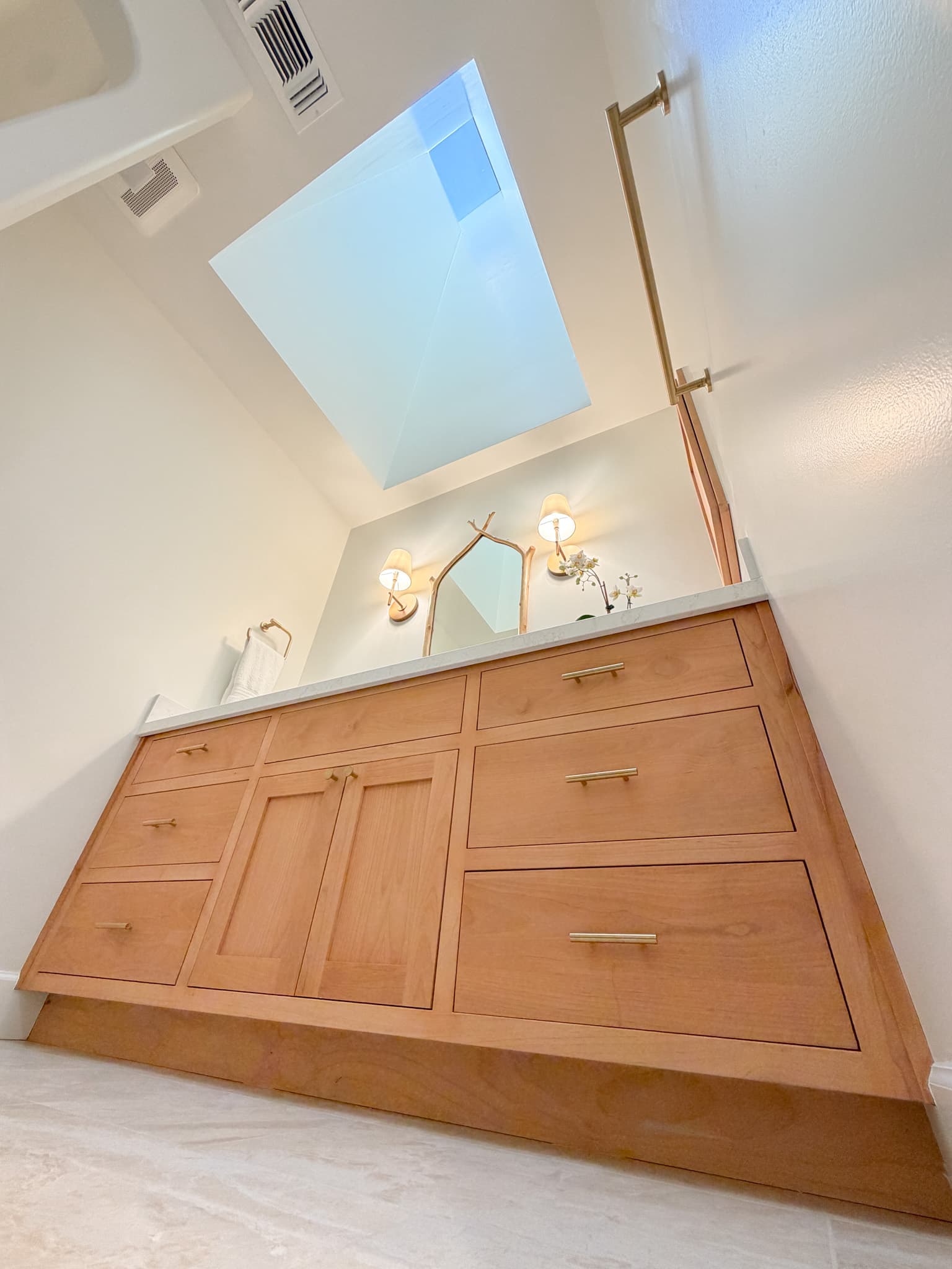 Bathroom Remodel in Carmichael — shaker cabinets, double vanity, quartz countertop, frameless glass shower, marble tile flooring