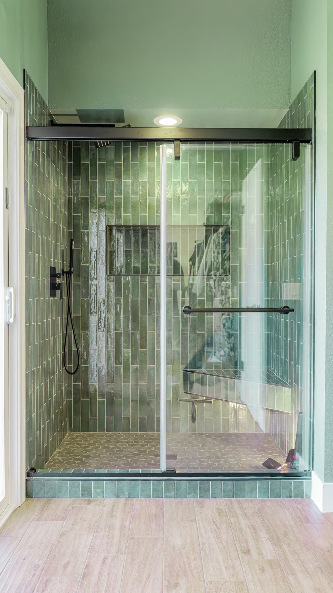 Bathroom Remodel in Sacramento — walk-in shower, frameless glass shower, tiled shower surround, handheld shower, shower bench