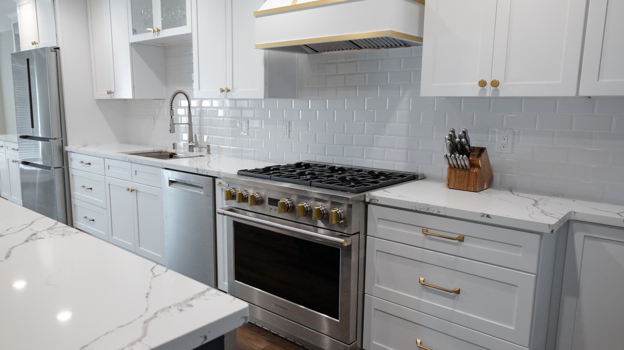 Kitchen Remodel in Roseville — shaker cabinets, subway tile backsplash, quartz countertop, professional gas range, range hood