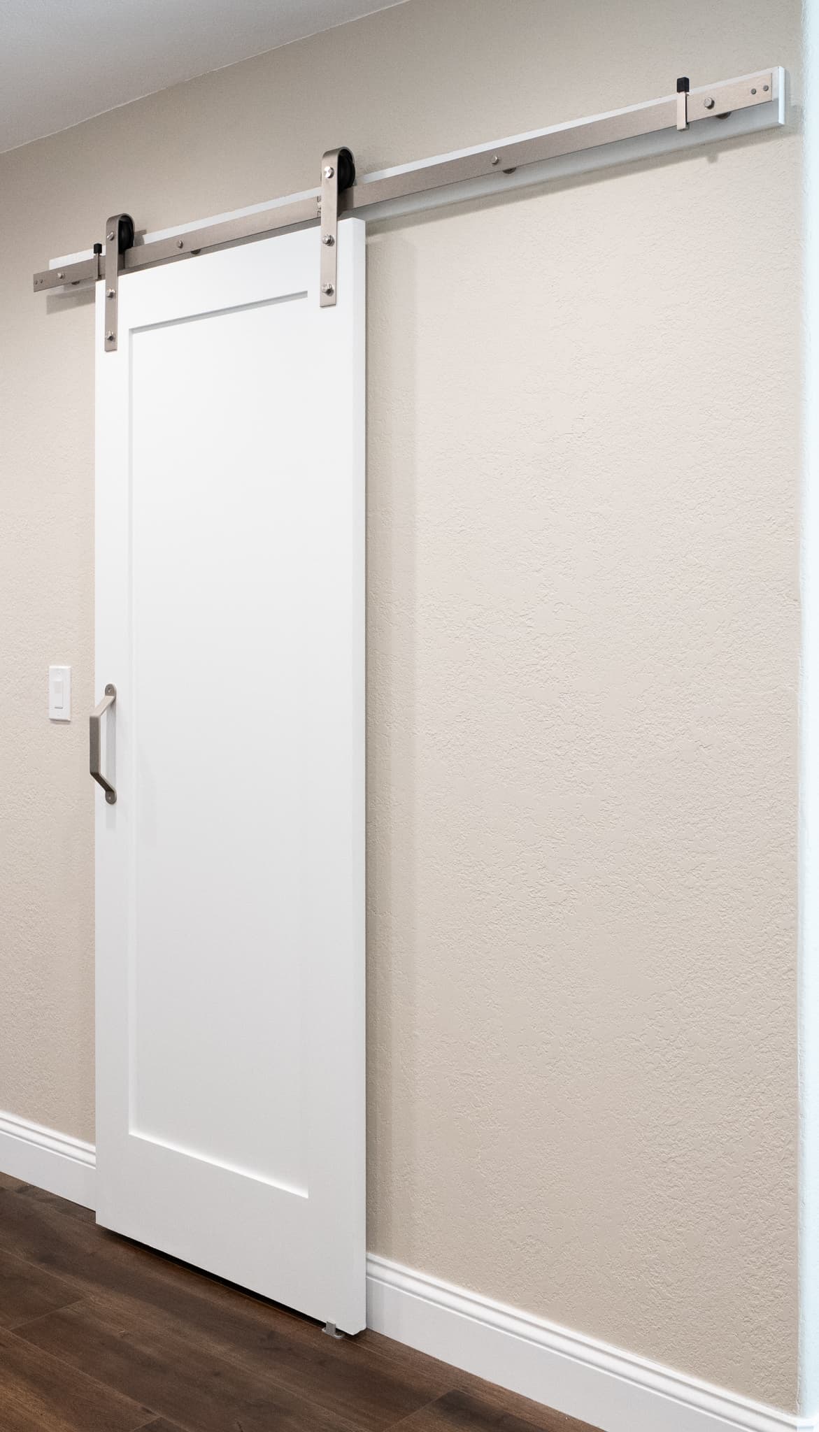 Kitchen Remodel in Roseville — barn-door entry, hardwood flooring, crown moulding