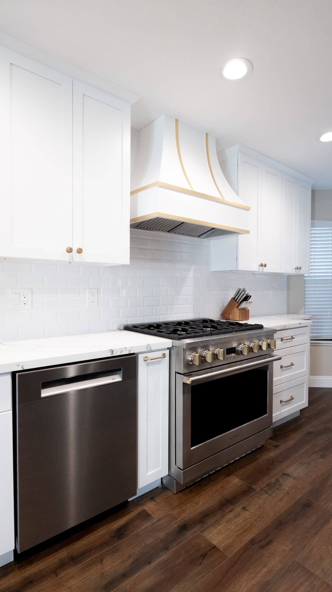 Kitchen Remodel in Roseville — shaker cabinets, range hood, professional gas range, subway tile backsplash, quartz countertop
