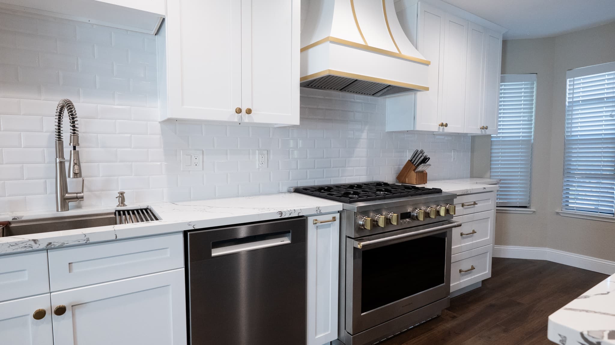 Kitchen Remodel in Roseville — shaker cabinets, subway tile backsplash, quartz countertop, professional gas range, range hood