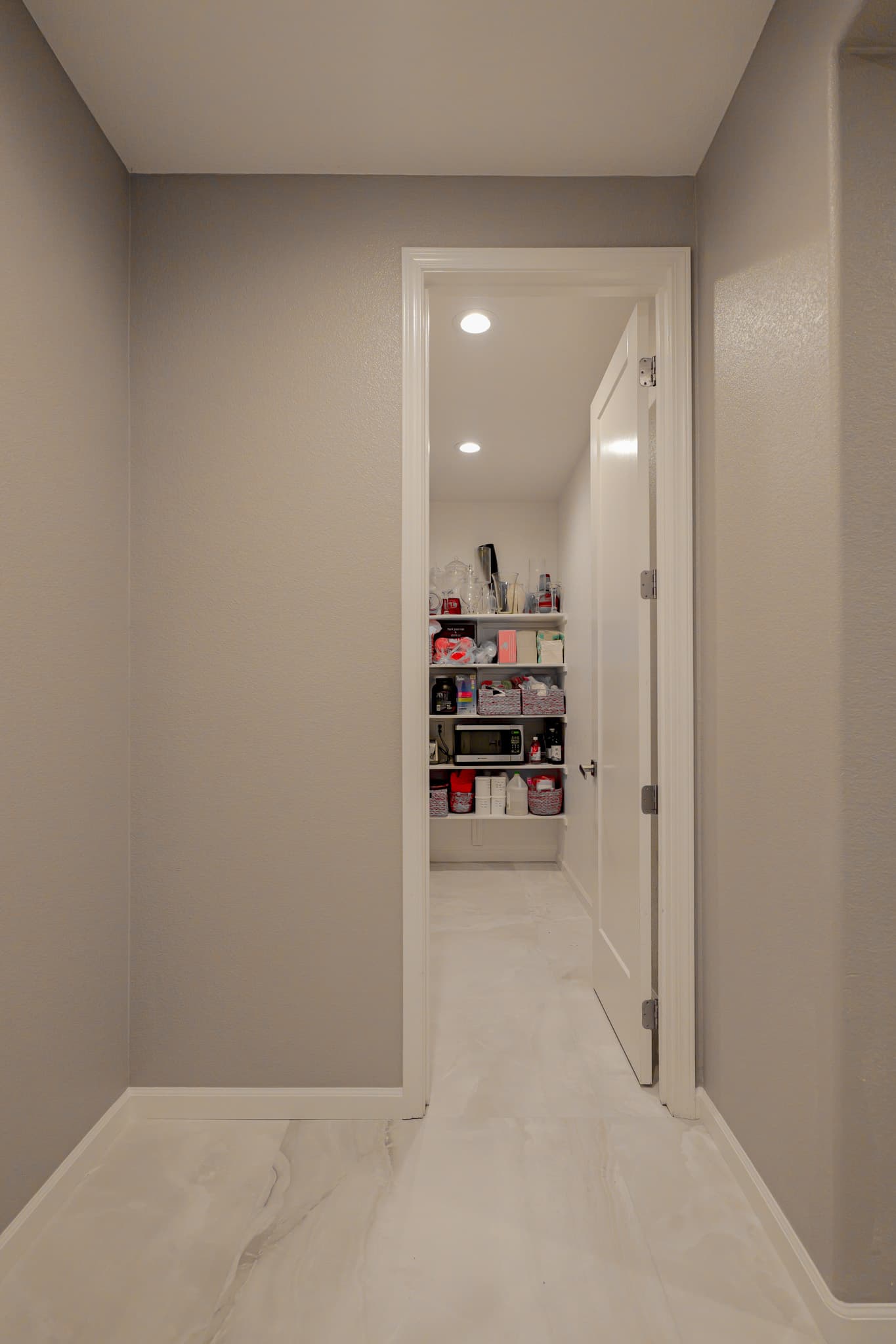 Kitchen Remodel in Sacramento — recessed lighting, built-in shelving, marble tile flooring, luxury vinyl plank