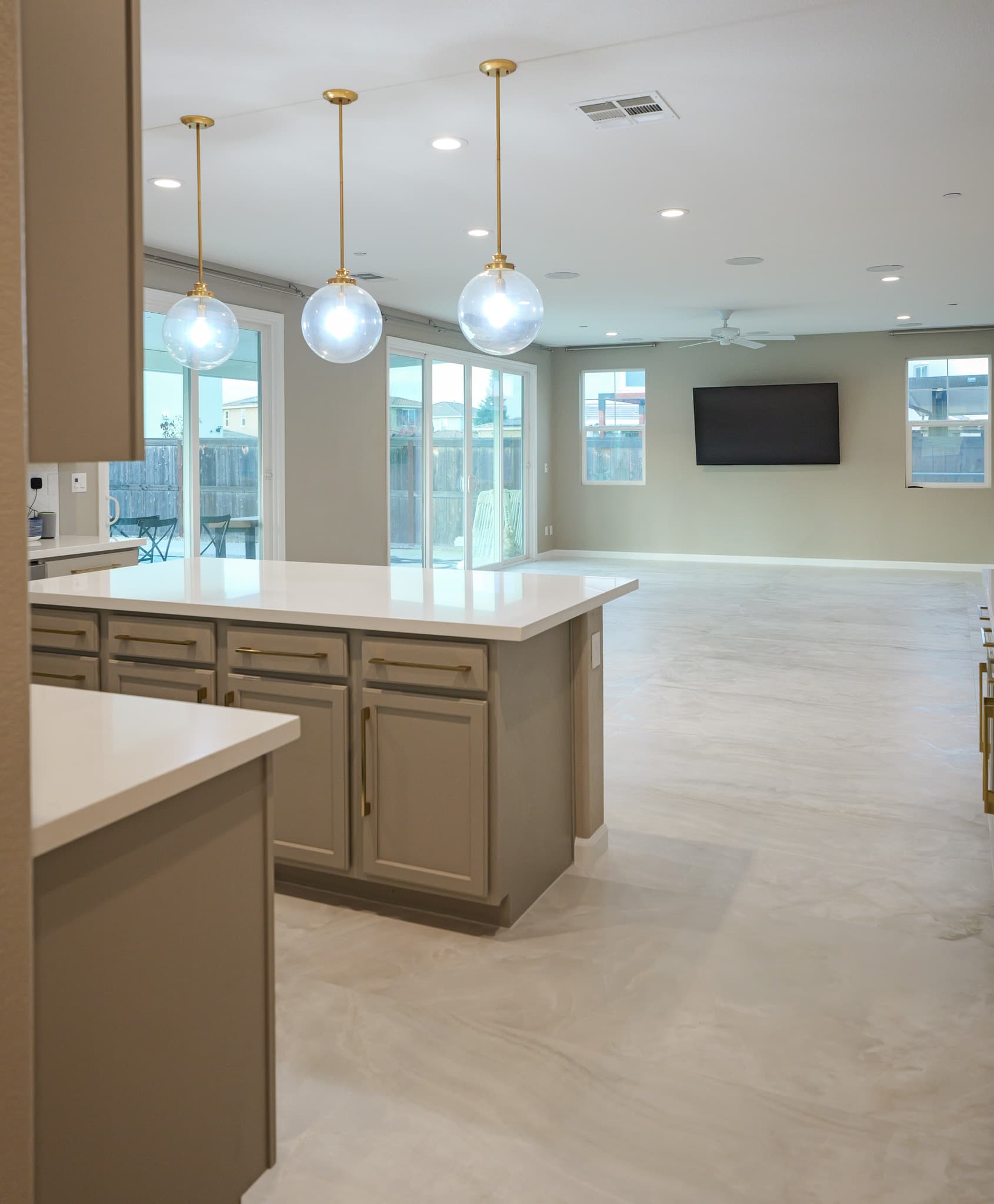 Kitchen Remodel in Sacramento — kitchen island, pendant lighting, recessed lighting, quartz countertop, open-concept layout