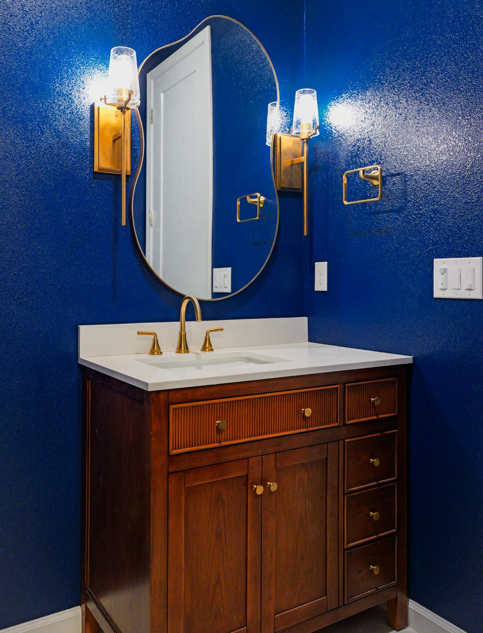 Kitchen Remodel in Sacramento — single vanity, undermount sink, quartz countertop, framed mirror, custom cabinetry