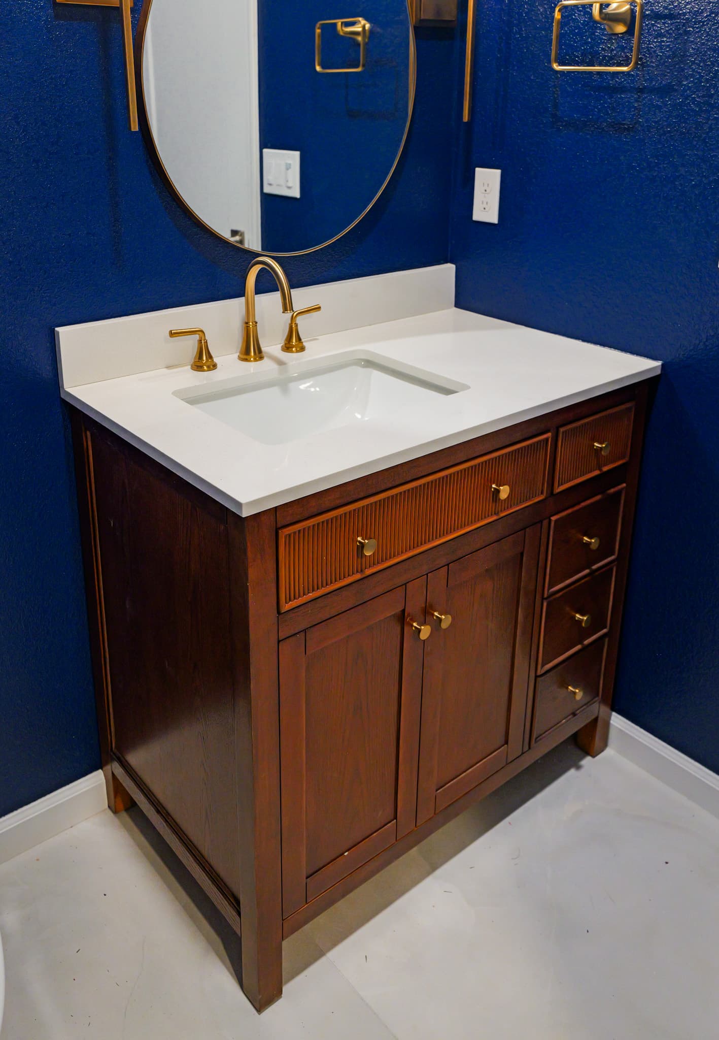 Kitchen Remodel in Sacramento — single vanity, undermount sink, quartz countertop, framed mirror, custom cabinetry