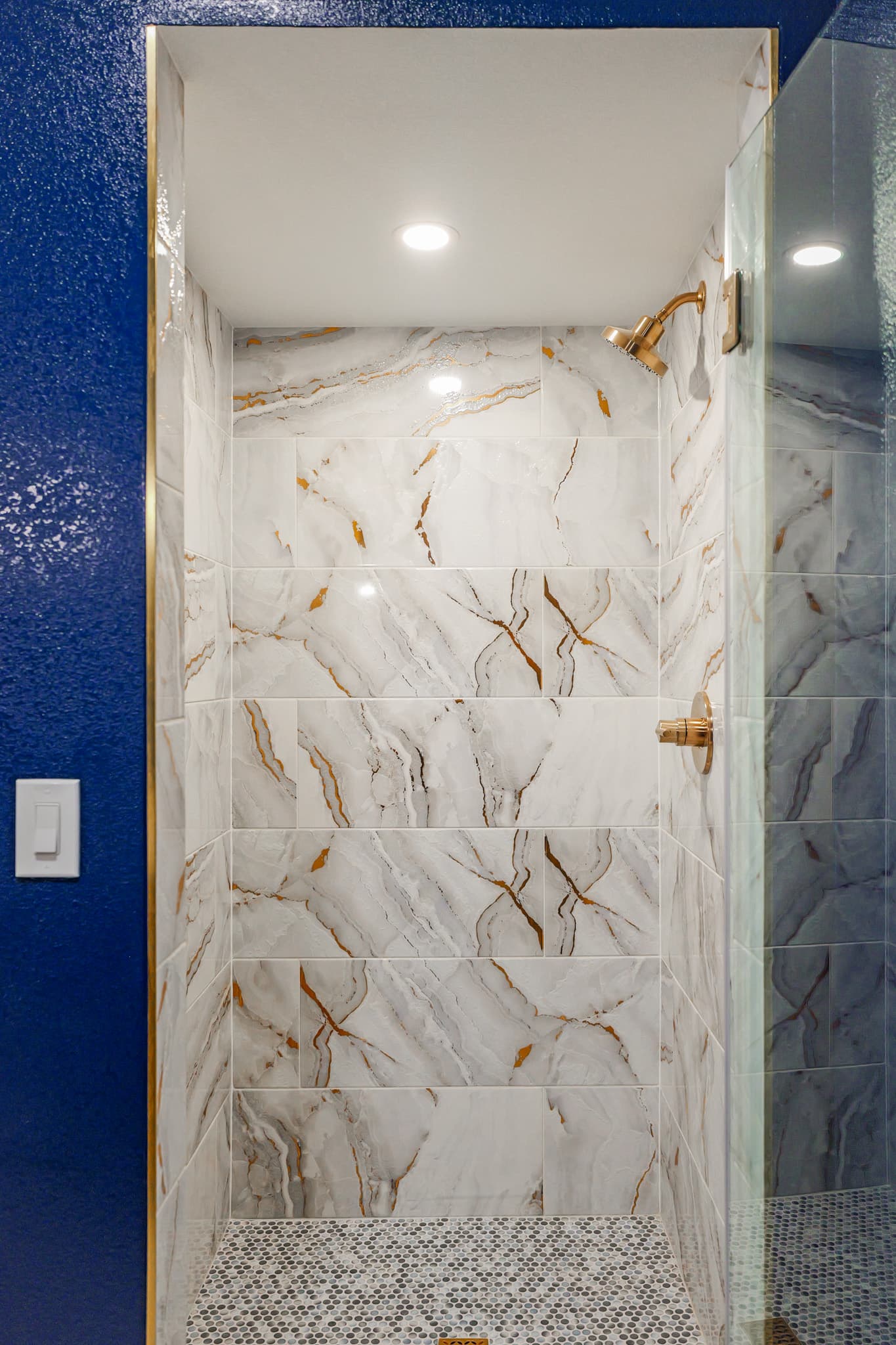 Kitchen Remodel in Sacramento — walk-in shower, frameless glass shower, tiled shower surround, marble tile flooring, recessed lighting