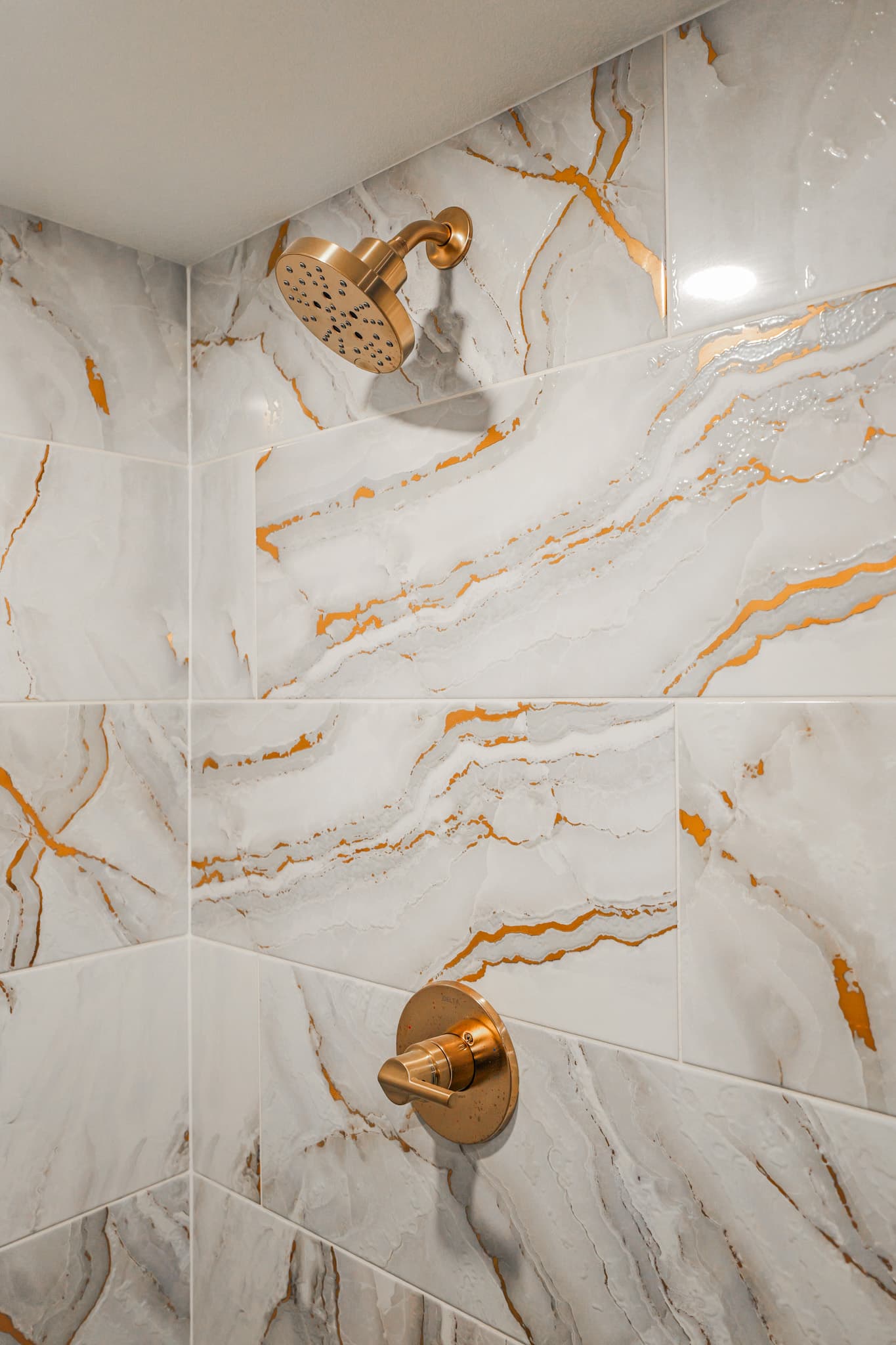 Kitchen Remodel in Sacramento — tiled shower surround, walk-in shower, rain shower head, marble tile flooring, recessed lighting
