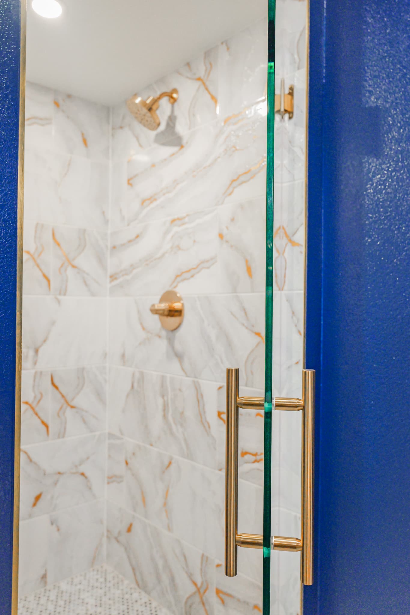 Kitchen Remodel in Sacramento — frameless glass shower, tiled shower surround, walk-in shower, marble tile flooring, recessed lighting