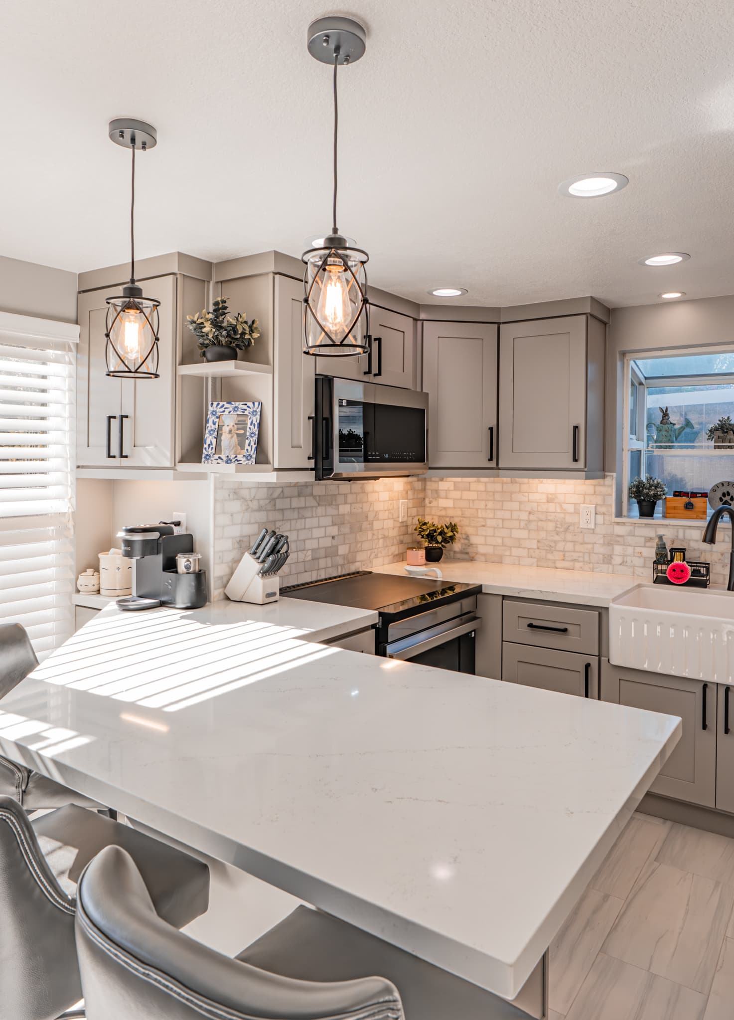 Kitchen Remodel in Citrus Heights — shaker cabinets, quartz countertop, natural-stone backsplash, pendant lighting, farmhouse sink