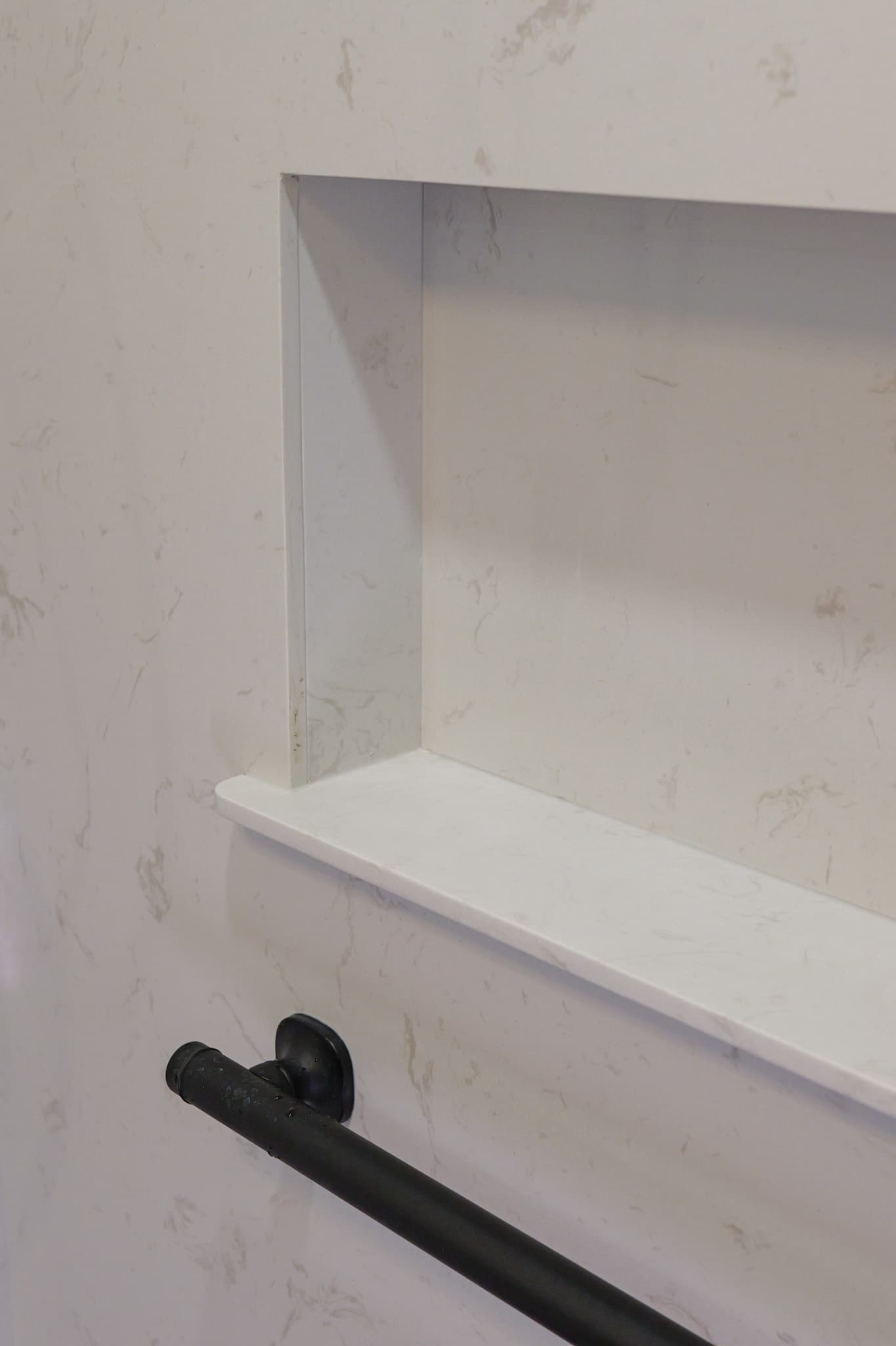 House Renovation in Rocklin — walk-in shower, marble tile flooring, tiled shower surround, built-in shelving, shower bench