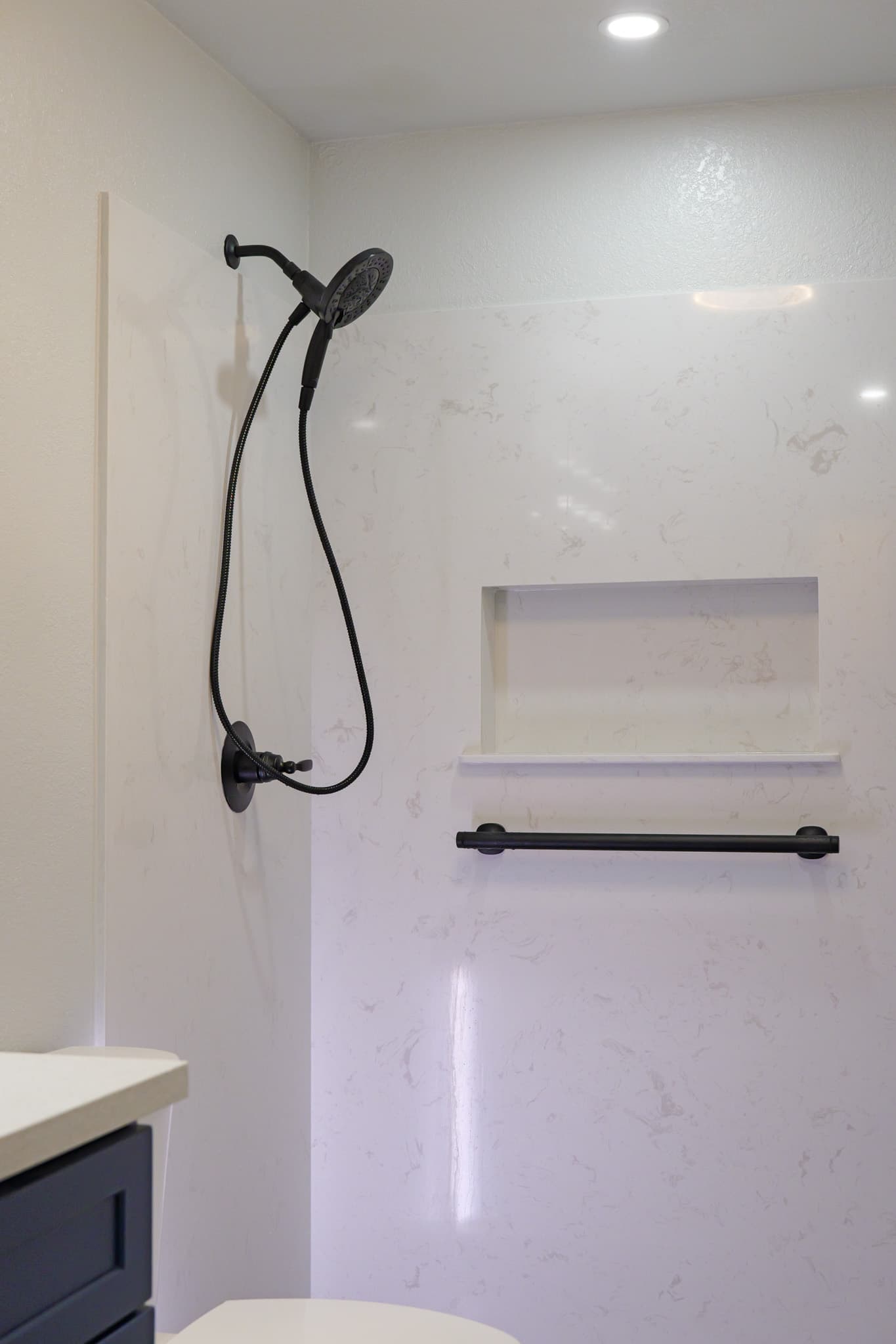House Renovation in Rocklin — walk-in shower, handheld shower, tiled shower surround, recessed lighting, single vanity
