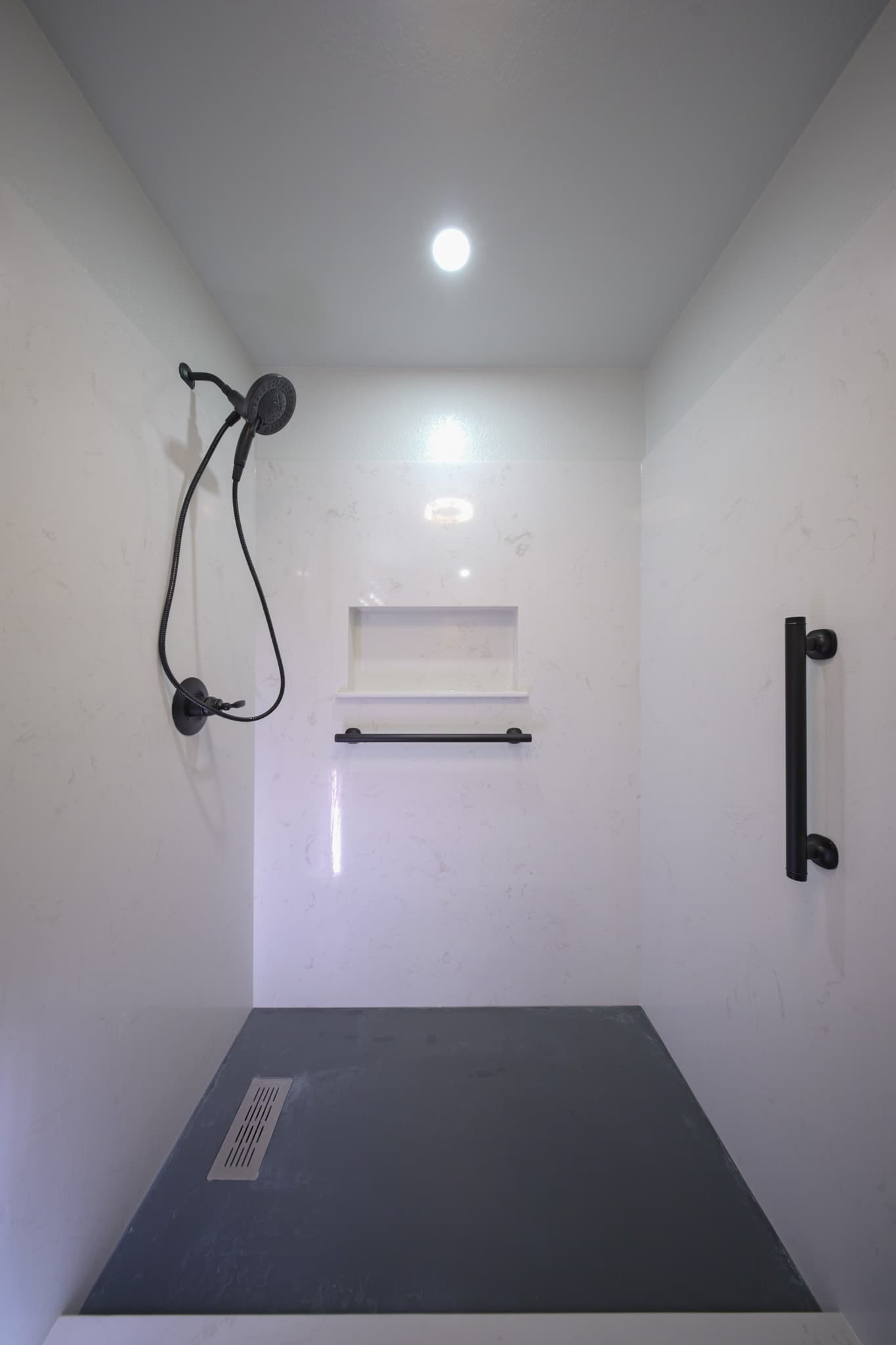 House Renovation in Rocklin — walk-in shower, handheld shower, recessed lighting, tiled shower surround, built-in shelving