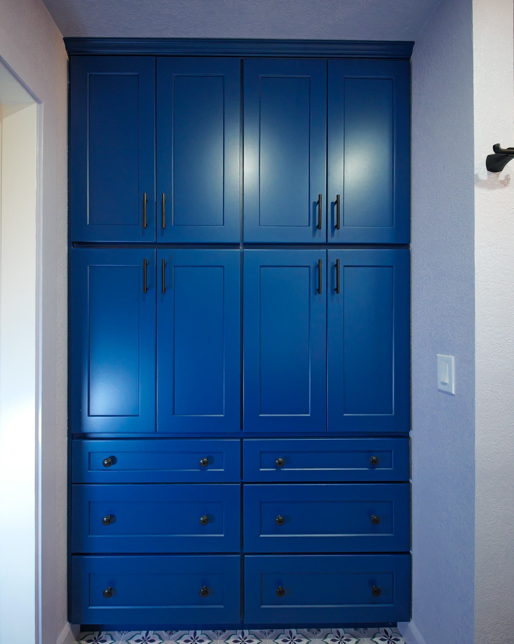 House Renovation in Rocklin — custom cabinetry, linen tower, raised-panel cabinets, crown moulding, ceramic tile flooring