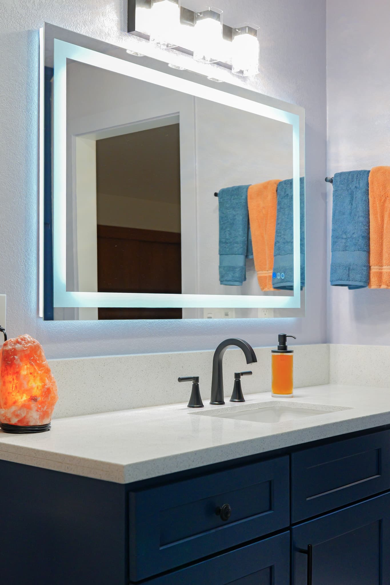 House Renovation in Rocklin — lighted mirror, single vanity, shaker cabinets, quartz countertop, undermount sink