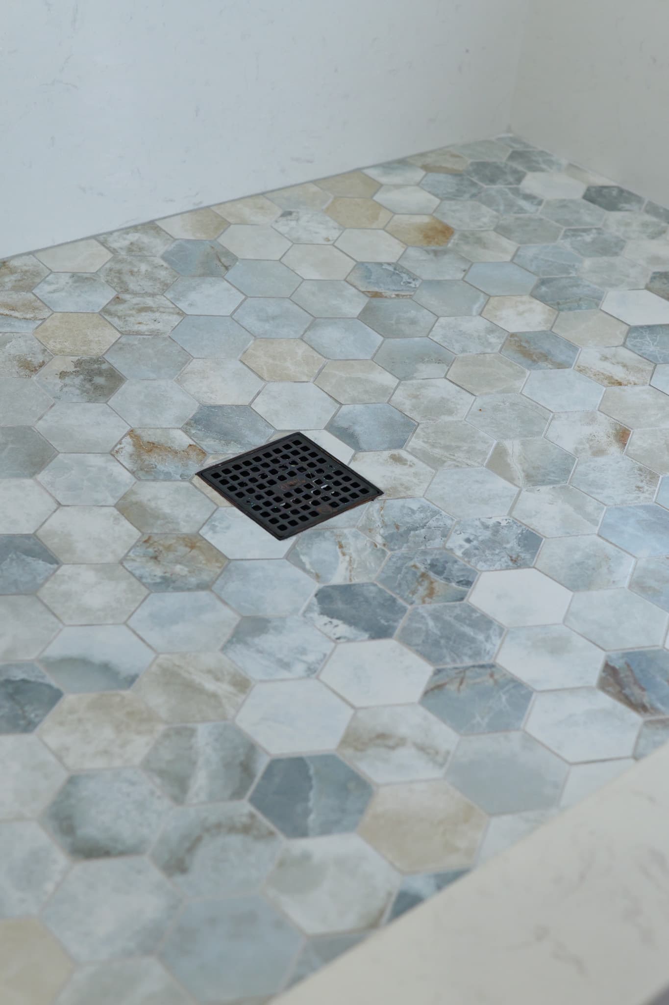 House Renovation in Rocklin — walk-in shower, natural-stone tile flooring, tiled shower surround, mosaic backsplash