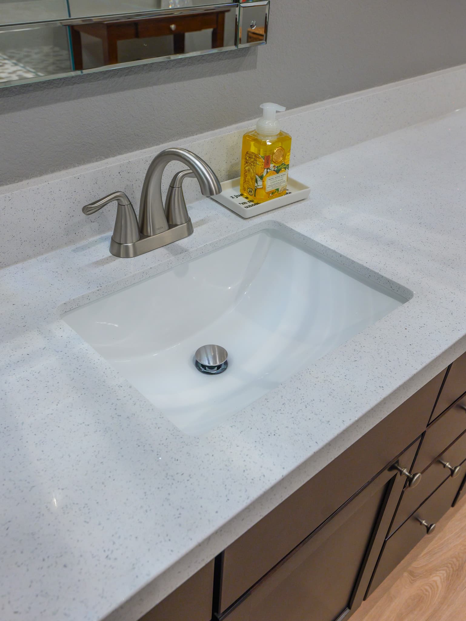 Bathroom Remodel in Roseville — undermount sink, quartz countertop, single vanity, shaker cabinets, framed mirror