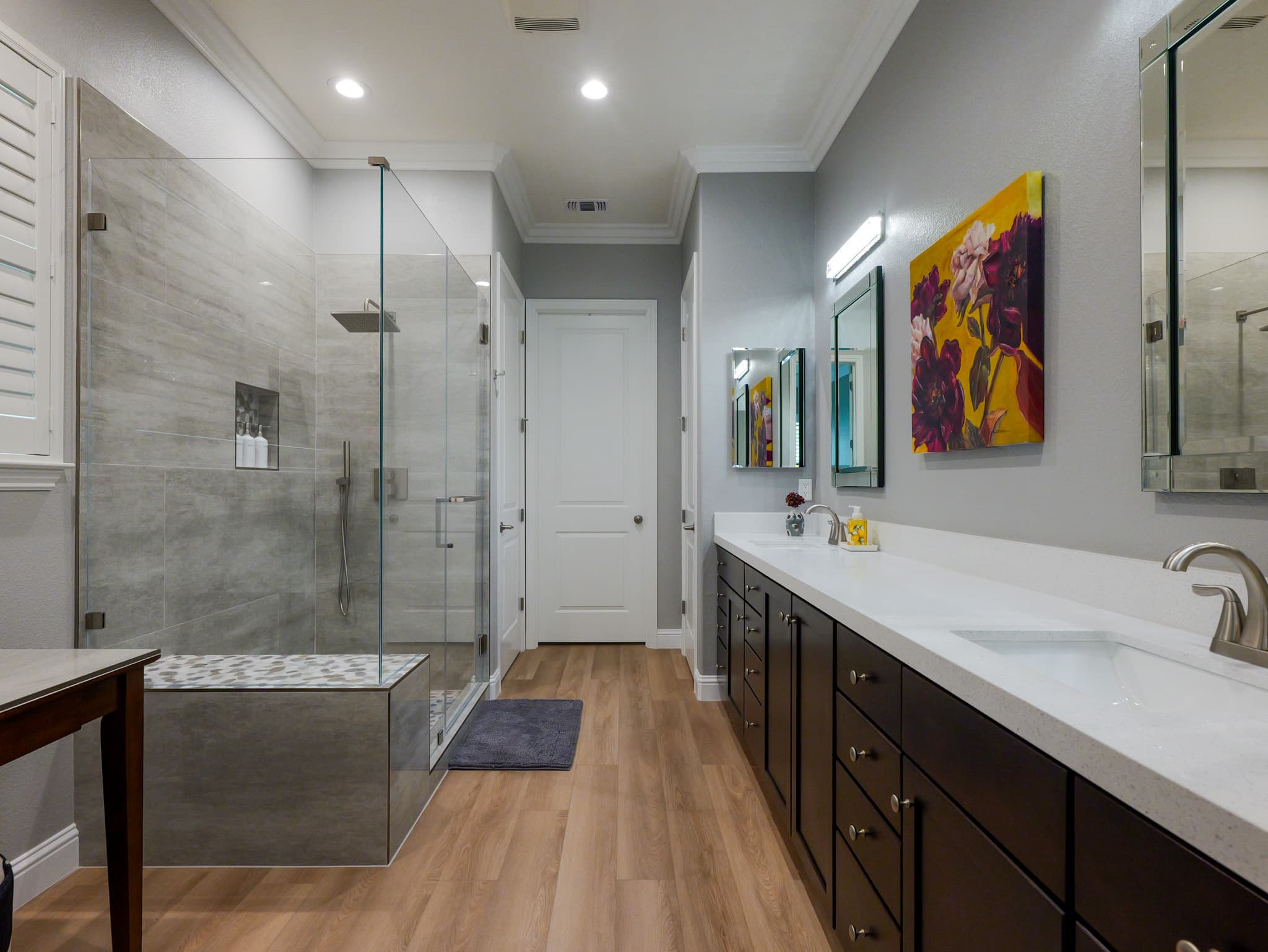 Bathroom Remodel in Roseville — frameless glass shower, tiled shower surround, double vanity, quartz countertop, luxury vinyl plank