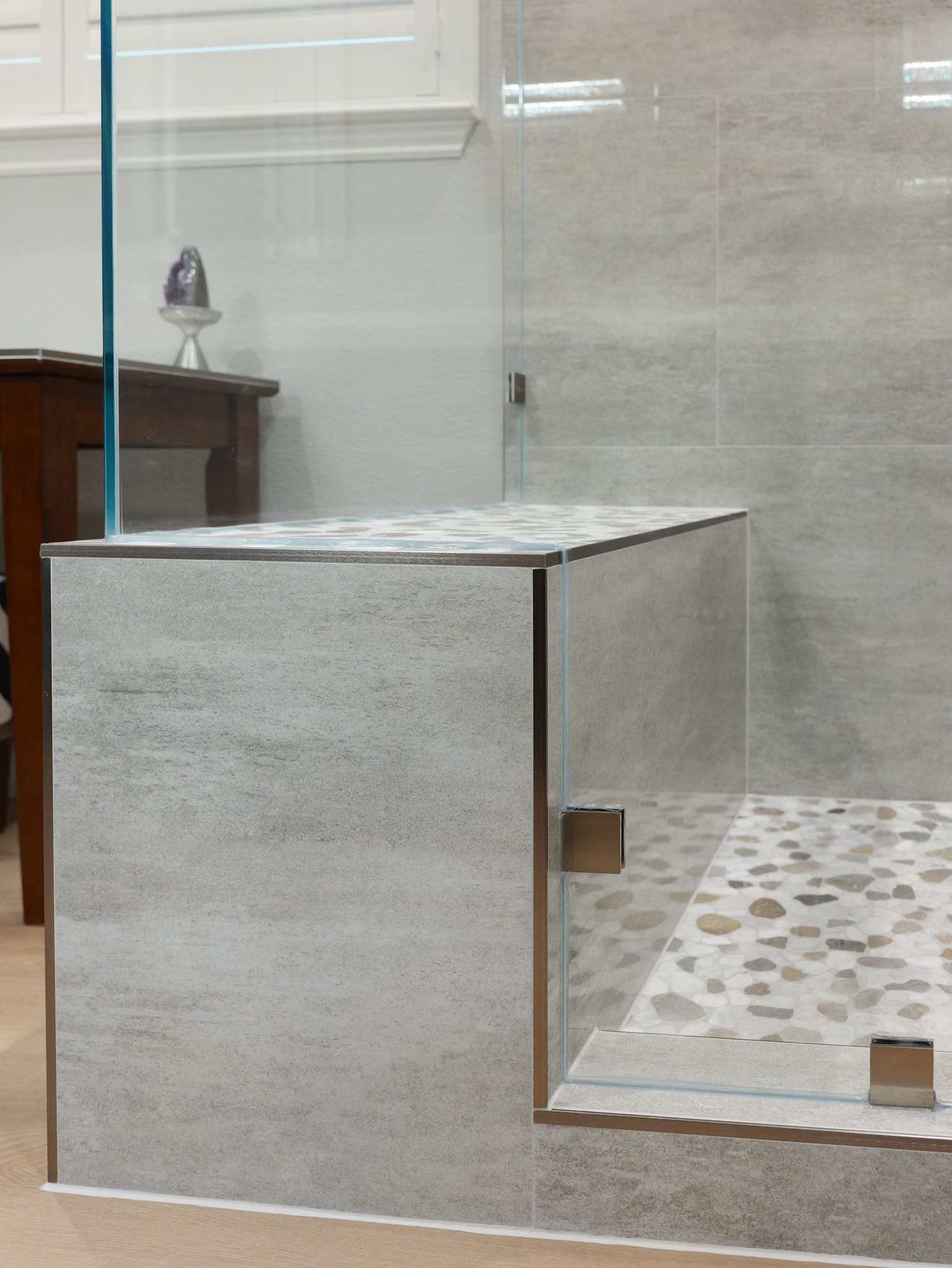 Bathroom Remodel in Roseville — frameless glass shower, walk-in shower, shower bench, tiled shower surround, mosaic backsplash