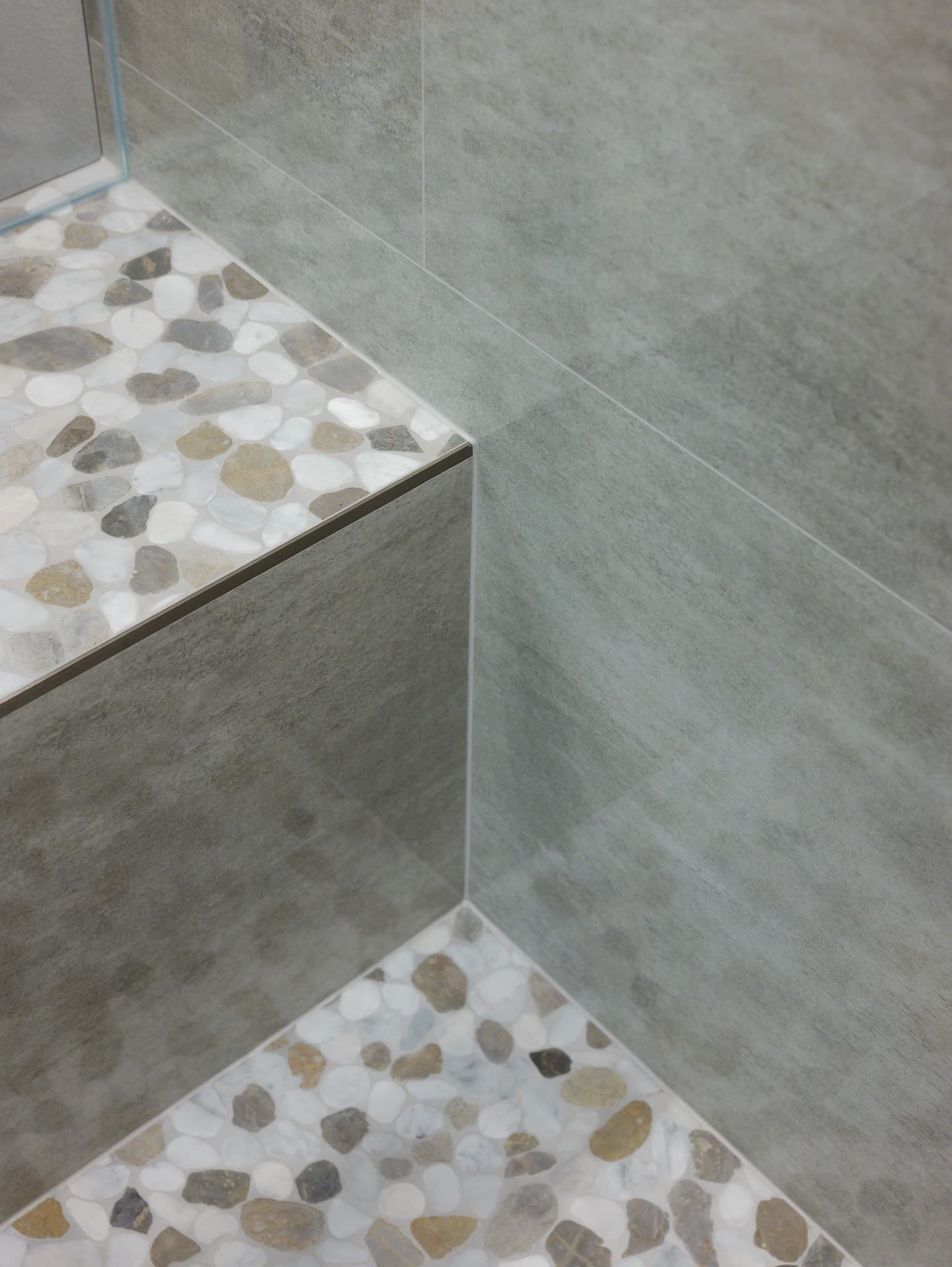 Bathroom Remodel in Roseville — walk-in shower, frameless glass shower, tiled shower surround, shower bench, mosaic backsplash